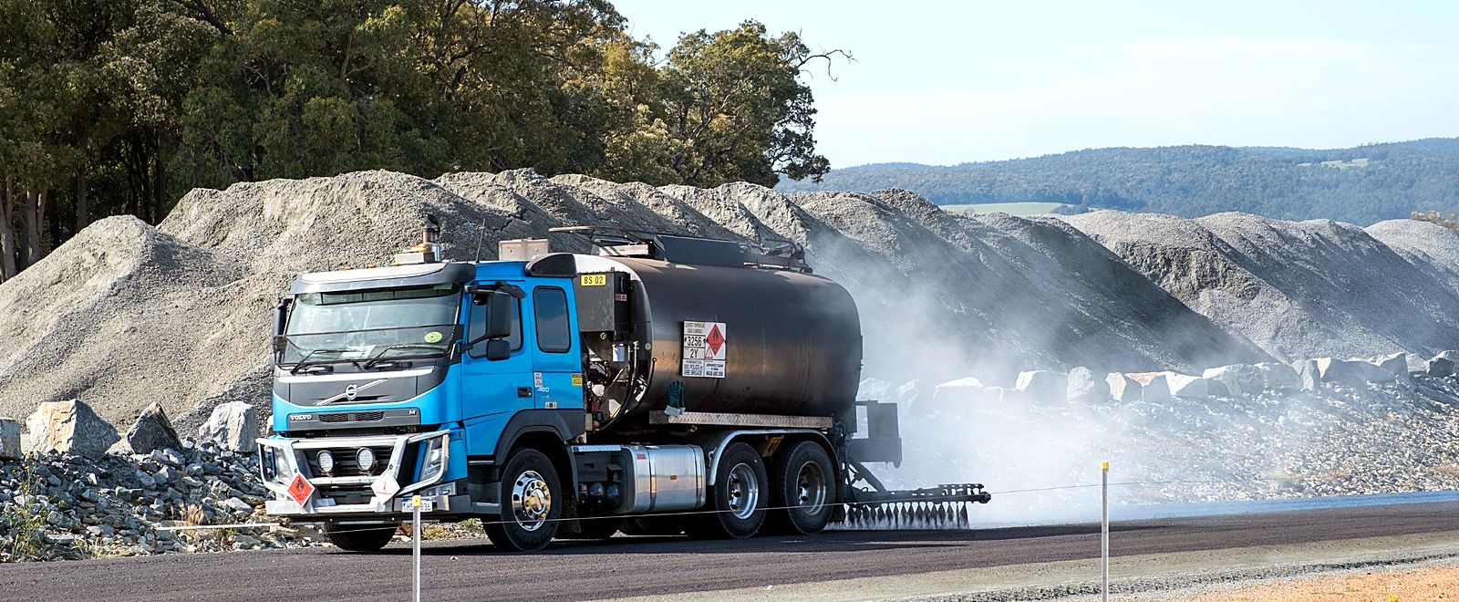 WA Sprayseal Volvo bitumen sprayer applying a seal